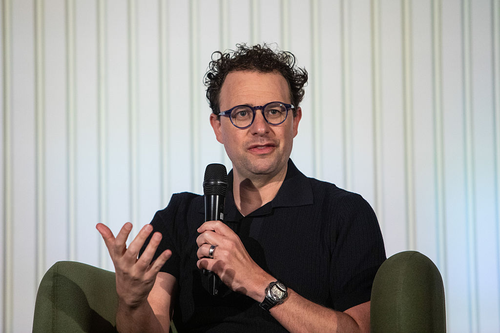David Sacks says "Dario Amodei believes frontier AI is too powerful to distribute; we believe it is too powerful to centralize" after Amodei shared policy ideas