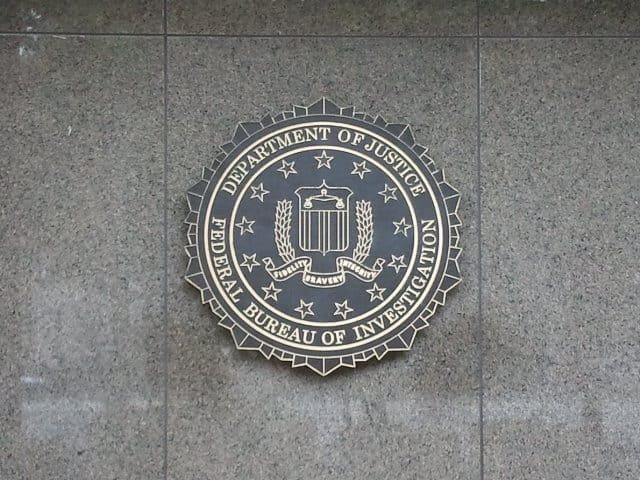 ShinyHunters claims it used an Oracle PeopleSoft zero-day to hack FBI-related services and steal employee and applicant data; it also defaced the FBI jobs site
