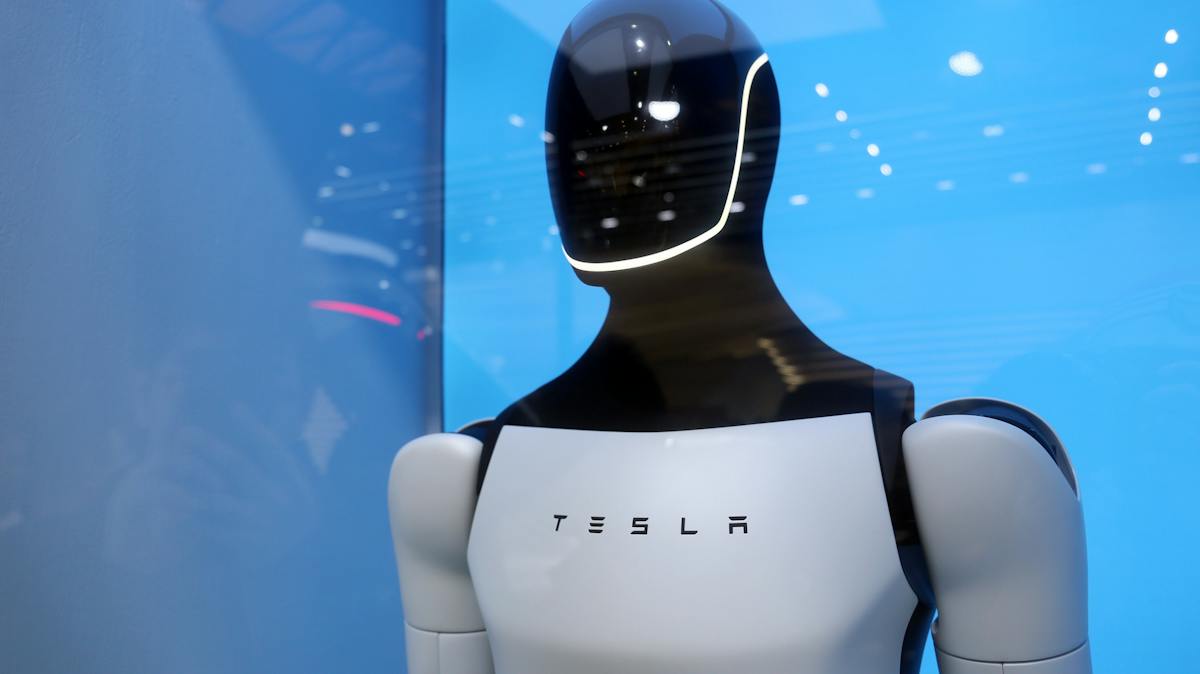 Tesla ramped up Optimus production to several hundred units per week but faces hurdles with its hands, automation equipment, and supplier constraints
